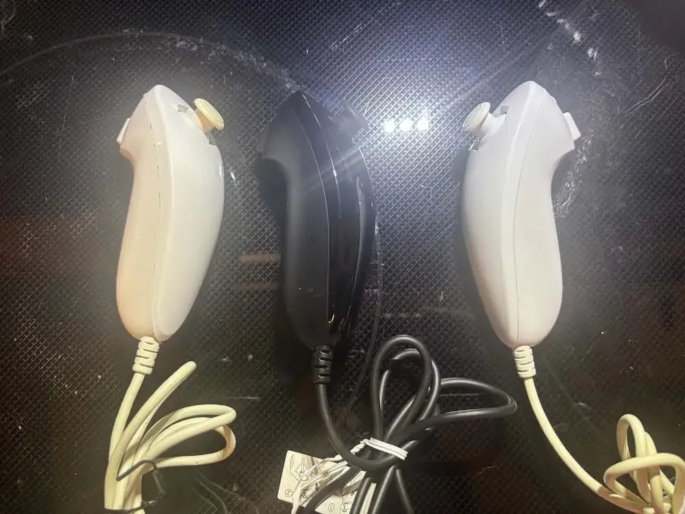 Nintendo Wii RVL-101 Black Console Bundle with Remotes, Nunchucks, and Cables